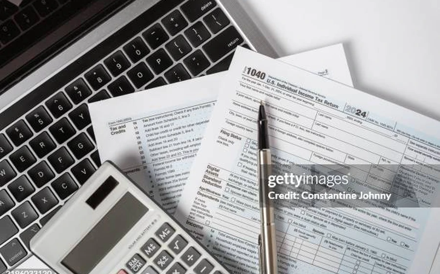 Tax documents and calculator image